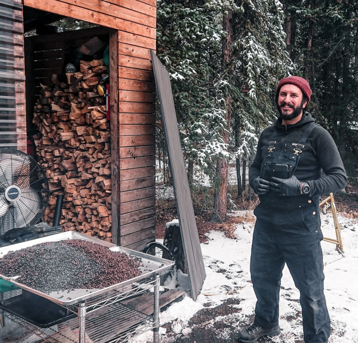 A pictue of our founder at The original woodfire coffee shack where Firebean was founded in the Yukon wilderness under the northern lights, while he Traveled Yukon
