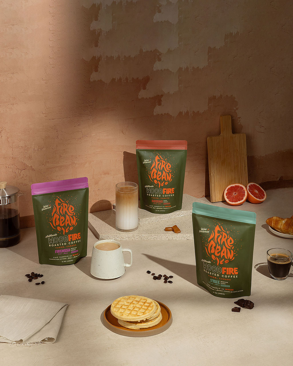 picture of Dark Roast and Medium Roast coffee and a french press