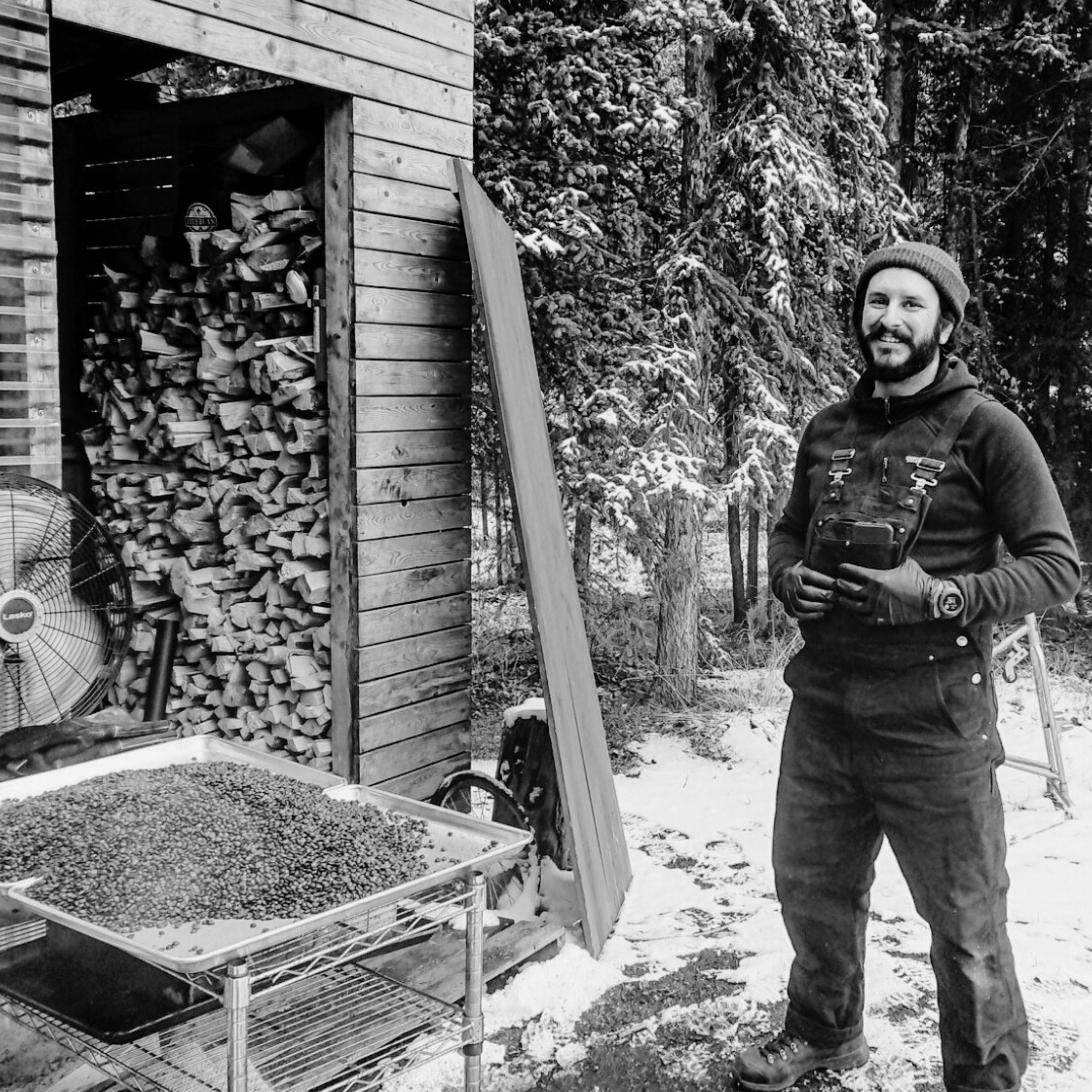 A pictue of our founder at The original woodfire coffee shack where Firebean was founded in the Yukon wilderness under the northern lights, while he Traveled Yukon