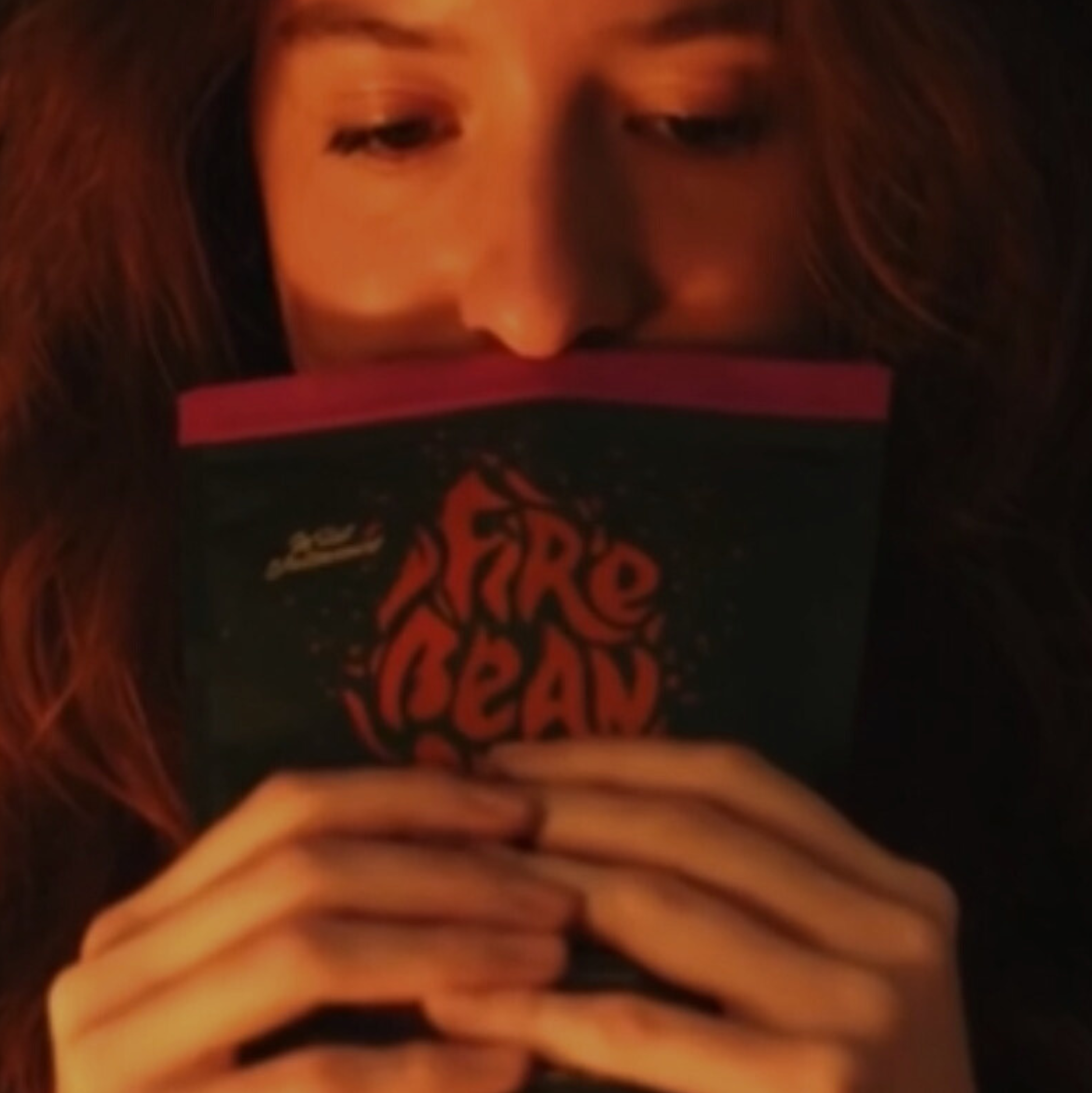 Person holding a bag of fiebean coffee